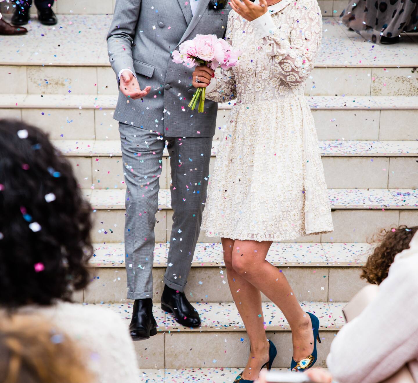 married couple descending steps of a London wedding venue