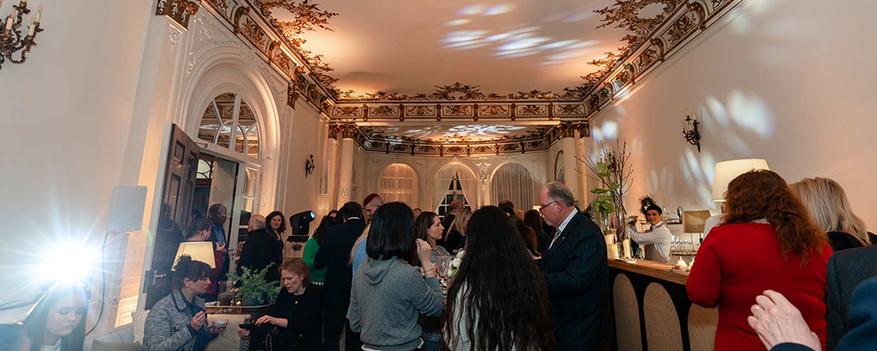 people socialising in a london venue for a christmas drinks reception