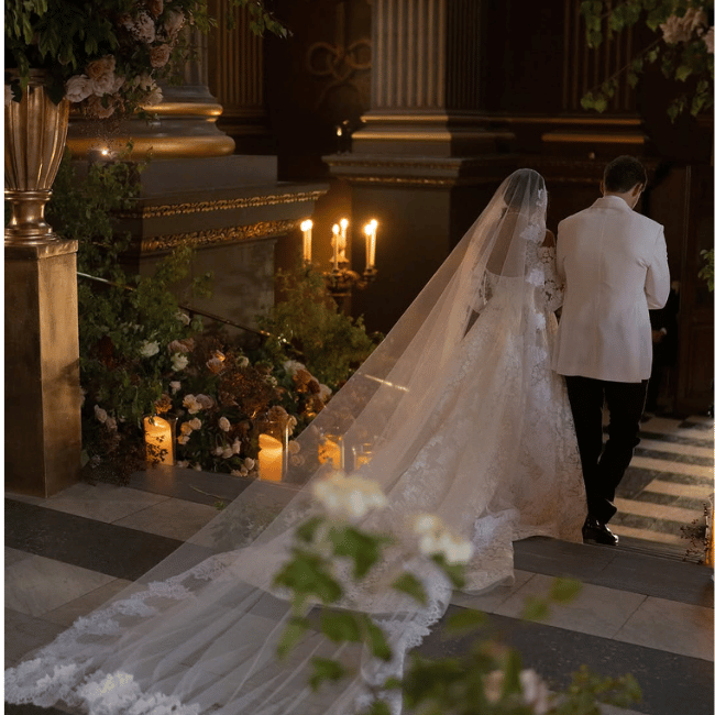 two people on their wedding day walking down the isle