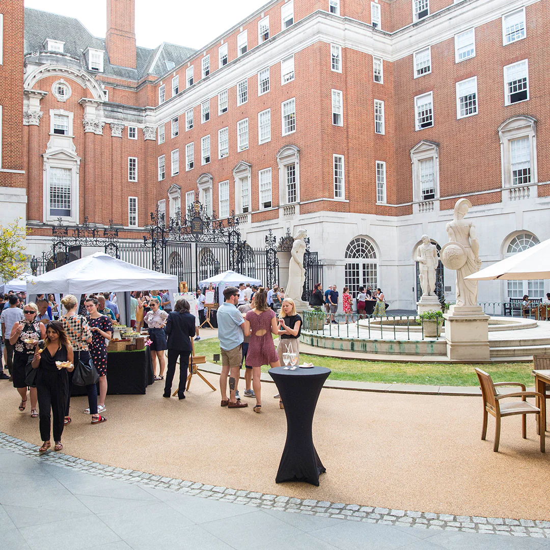 10 amazing summer party ideas cover people in courtyard socialising in the sun